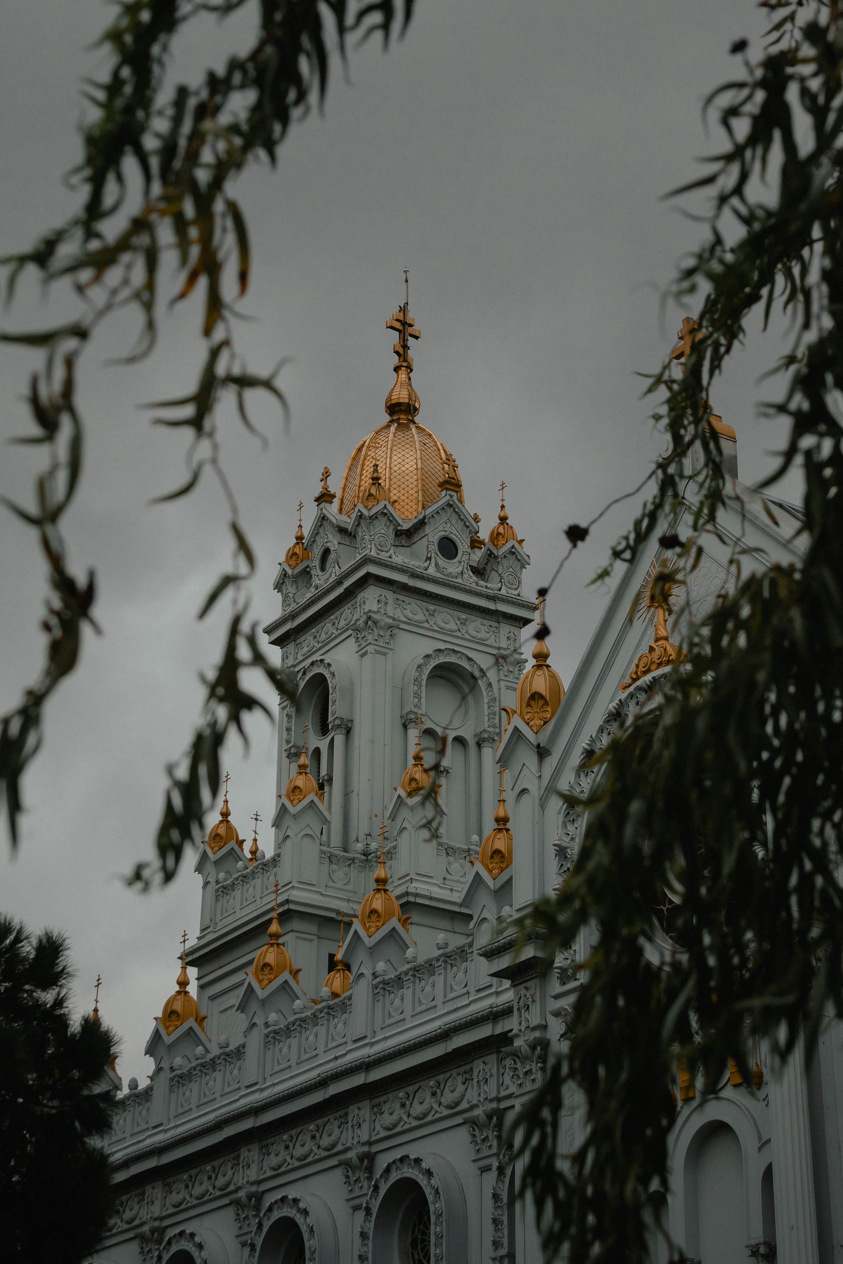 white and gold cathedral under cloudy sky